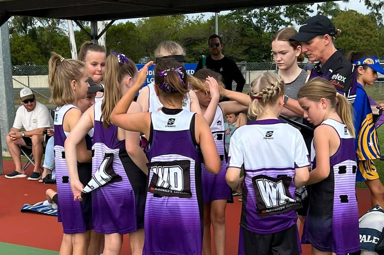 Thunderbolts Netball Coach Talking To Team